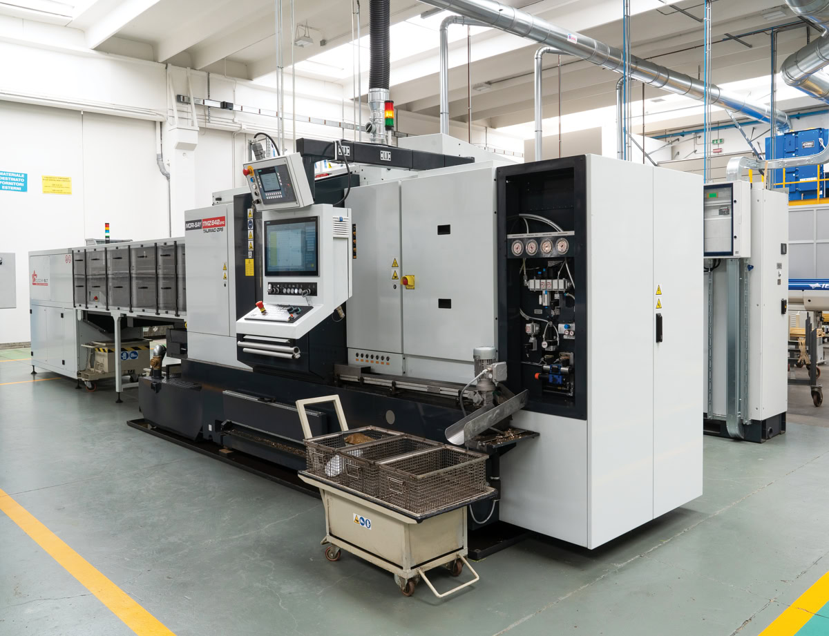 Six-spindle CNC lathe with multi-tube bar loader at Eredi Baitelli
