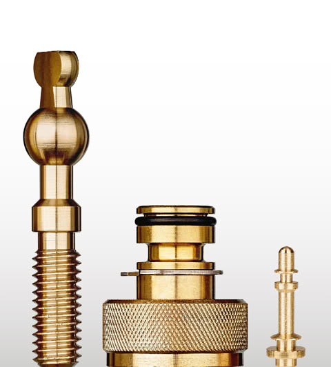 Three brass turned parts: a threaded ball stud, a knurled fitting with an O-ring, and a small pin