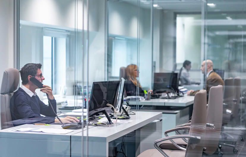 Staff working at their desks in the office